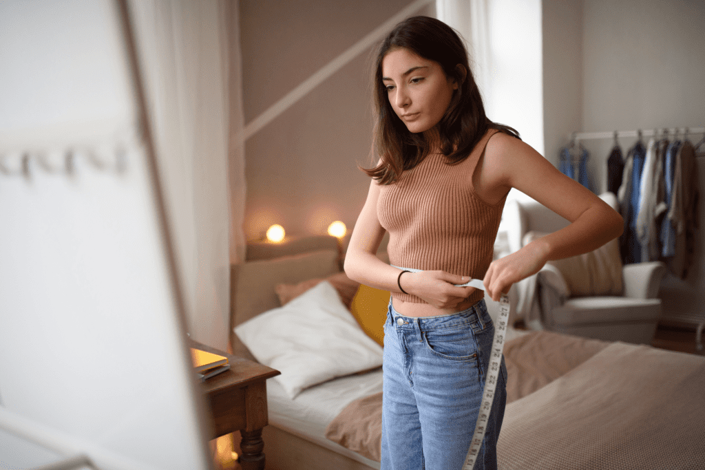 Girl with bulimia nervosa in her room